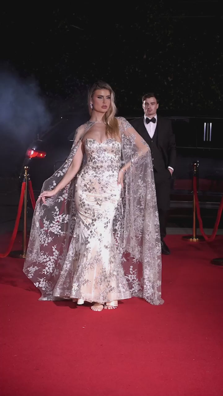 STRAPLESS FITTED GOWN WITH LACE CAPE